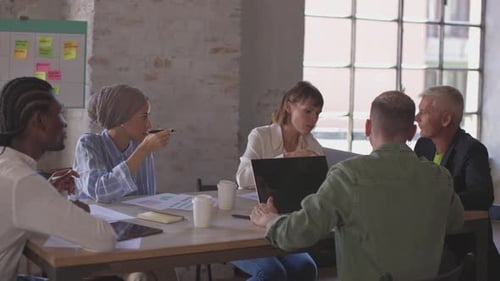 multicultural creative professionals managers working together in team brainstorming sitting in boar