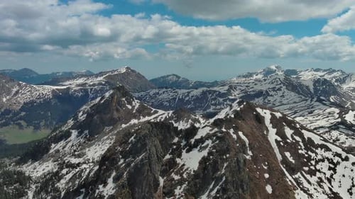 Rocky Snow Mountains Before Sunset Aerial