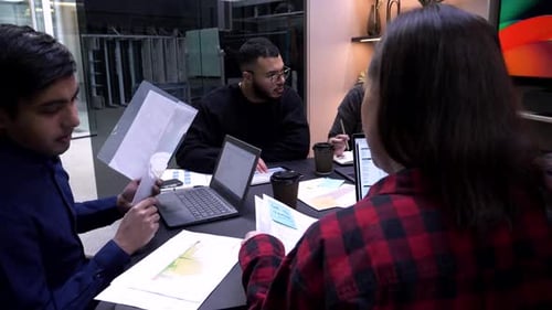 Group of colleagues working at a meeting table