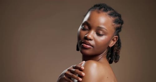 Skincare, face and shoulder with black woman in studio for beauty, body care and glow