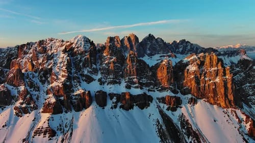 Rocky Snow Mountains at Sunrise Aerial