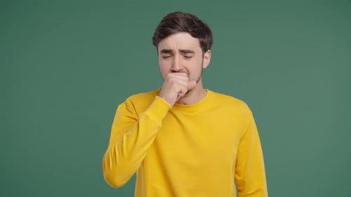 Young Man Has Sore Sick Guy With Swollen Throat On Green Studio AnginaCoughs