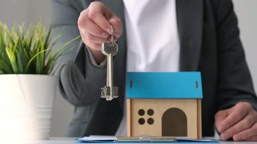 Real Estate Agent or Property Realtor Give Keys to Buyer After Singing Contract