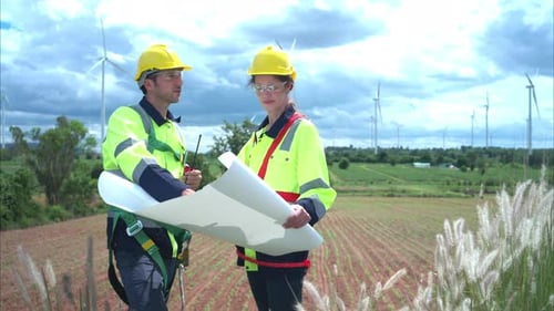 Wind Turbine Engineers Working in a Rural Field
