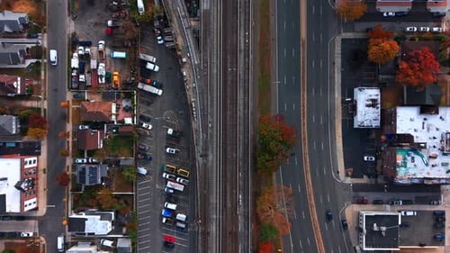 A top down, aerial view of Sunrise Highway running parallel to the Long Island Railroad tracks.