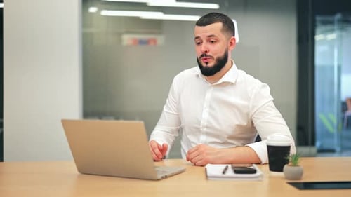 Bearded Man Talking During Online Business Video Call