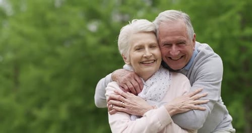 Park, happiness and senior couple hug, security and trust for marriage people in outdoor nature