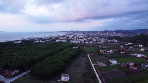 Aerial above albanian suburb of Durres during cloudy day.