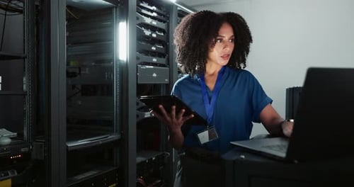 Tablet, engineer and woman on laptop in server room for cyber security, coding or update database