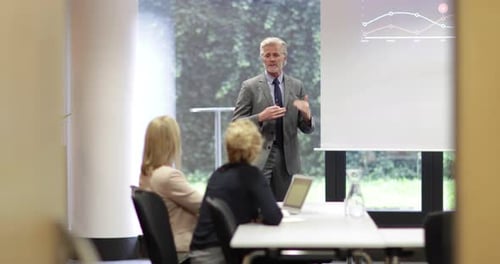 Business Presentation with Graph for Colleagues in Office