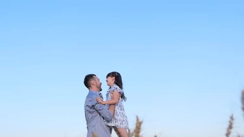 Loving Father and Daughter Embrace in a Rural Field