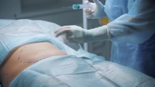 Medical Professional Prepares Patient for Surgery