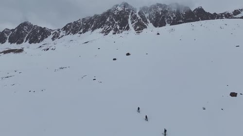 Mountain Peaks Emerging Through Dense Clouds High Altitude View