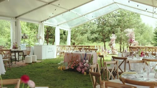 Elegant Wedding Reception Under Tent With Floral Decor