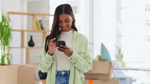 Woman Using Mobile Phone in Apartment