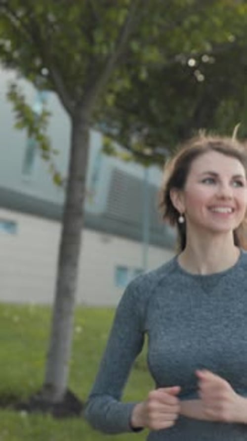Vertical Screen Young Woman Runner Training in Summer Park City Portrait of