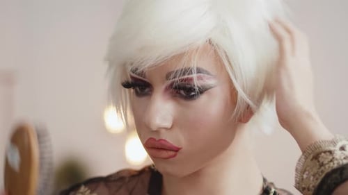 Person with White Wig Brushing Hair, Close Up