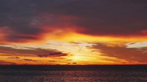 Golden Sunset Over Calm Ocean Waters at Dusk