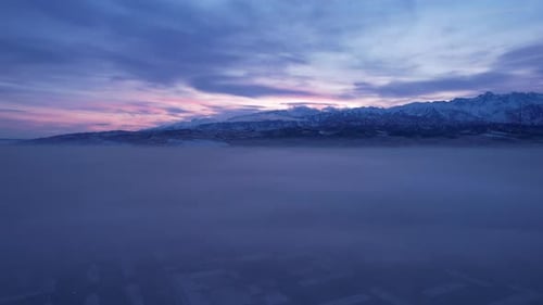 Dawn Over the City in Fog and Smog