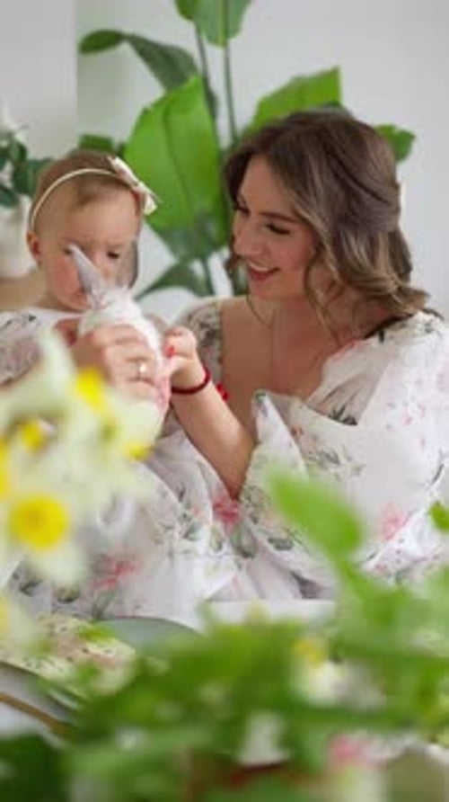 Mother and Infant with Easter Decorations and Bunny