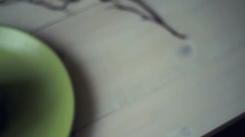 Pancake stack panning on green plate for delicious american breakfast at kitchen table