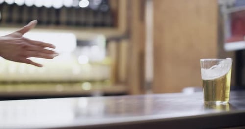 4k video footage of a young man ordering beer at a bar