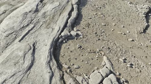 Aerial View of Cracked Earth in Arid Terrain
