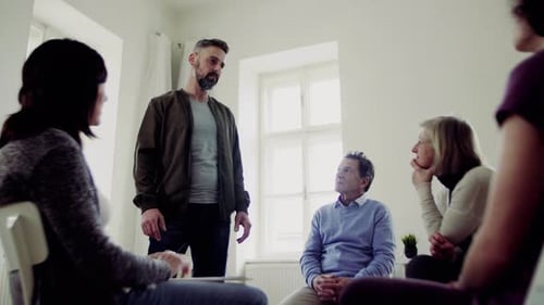 Group Meeting in Bright Room with Leader