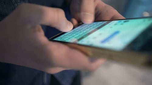 Typing on a Mobile Phone Keyboard Close Up