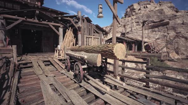 Historic Wooden Structure with Log Cart in a Mining Town at Sunset ...