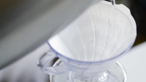 Water Poured Into a Pour Over Coffee Maker