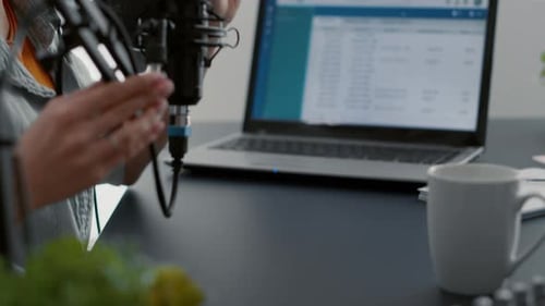 Joyful Podcaster Telling Life Stories to Audience While Using Mixer for Sound Tweaking