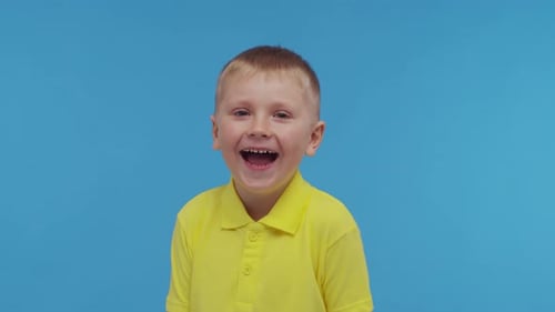 Portrait of Happy Smiling Boy in Tshirt Attractive and Expressive Kid in Studio