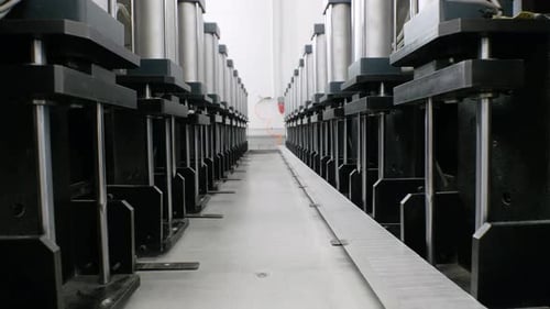 Automated Machine in Bright Factory with Dolly Shot