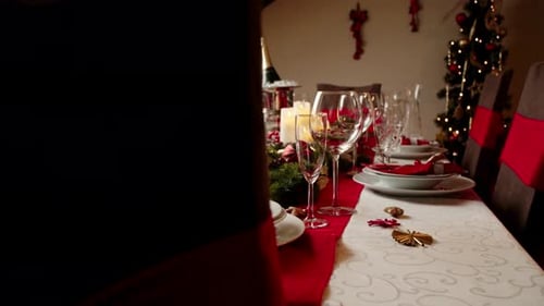 Festive Christmas Table Setting with Candles and Decor