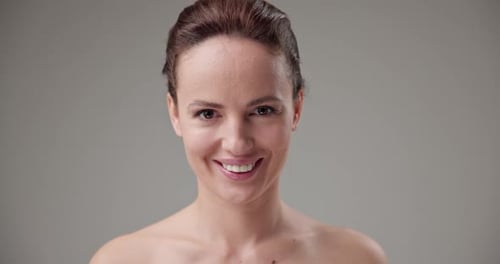 Woman Smiling and Talking to the Camera