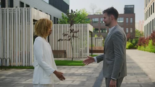 Professional Handshake Outdoors in Office Facility