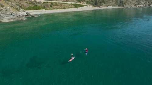 Stand Up Paddleboarding in Blue Green Ocean Waters