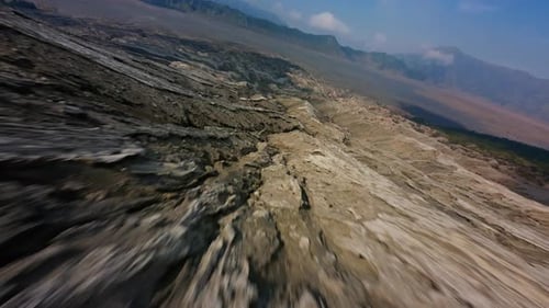 FPV Drone Flies Along the Solidified Lava of the Bromo Volcano Eruption