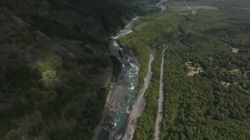 Mountain Valley with River Flowing to Blue Lake
