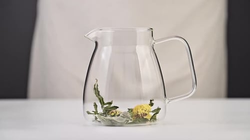 Adding Dried Herbs and Flowers to Glass Tea Pot