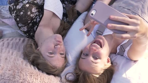 View From Above Happy Teenage Girl Friends Taking Selfie