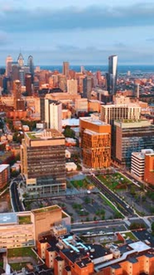 Sunlit scenery of Philadelphia downtown at sunset. Skyscrapers complex in the centre of the footage