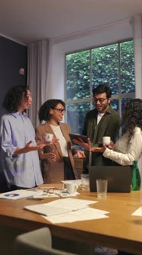 Diverse Business People Discussing Project Ideas Together During Creative Office Meeting