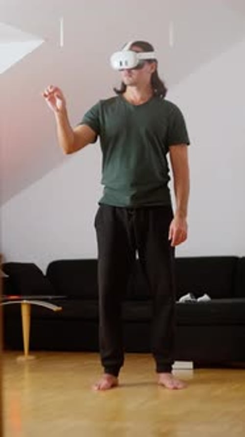 Man Using Virtual Reality Headset Interacting