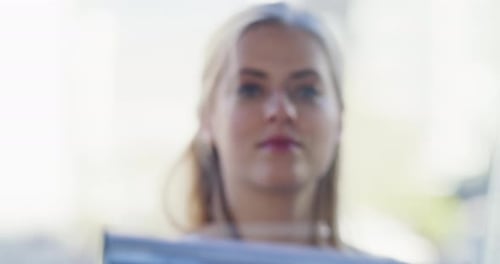 Woman Cleaning Glass with Squeegee Tool