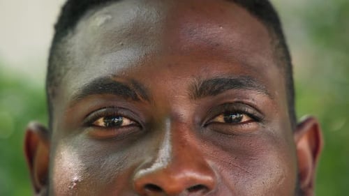 Close-up of mature man's eyes outdoors, reflecting calm and thoughtful expression