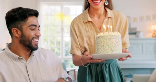 Birthday, cake and couple kiss with celebration, surprise and gift from wife to her husband
