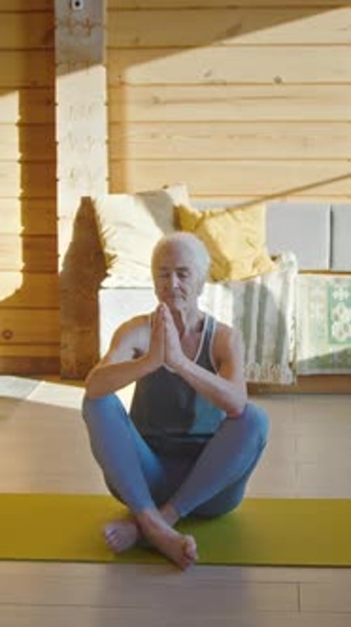 Senior Woman Practicing Yoga at Home