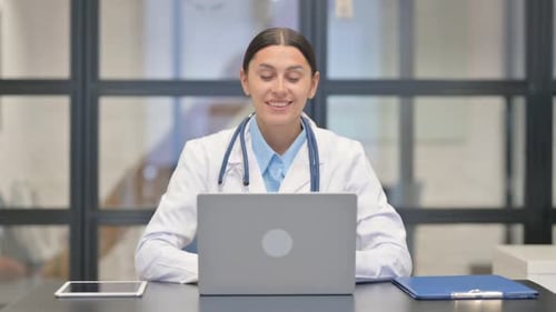 Doctor Using Laptop for Online Medical Consultation